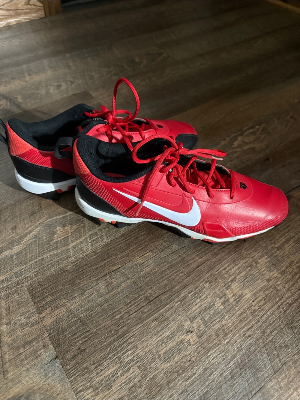 Nike Red and Black Baseball Cleats with White Swoosh